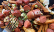 Poutine with bacon and sausage is served at a restaurant in Old Quebec City, Quebec, Canad...