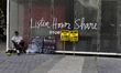 Signs are seen outside the immigration court in New York City, United States, on July 17,...