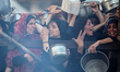 Palestinians gather at a food distribution point in Gaza City, on July 20, 2025. The World...