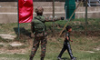 An Indian army soldier stands alert during the inaugural function of the Chinar Premier Le...