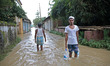 Locals wade through floodwaters in Parshuram, in Feni, Bangladesh, on July 21, 2025. The F...