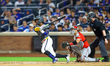 New York Mets player Luisangel Acuna singles during the seventh inning of a baseball game...