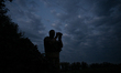 A soldier from a mobile fire team of Ukraine's 31st Mechanized Brigade holds binoculars du...