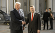 Ukrainian Foreign Minister Andrii Sybiha and Israeli Foreign Minister Gideon Saar shake ha...