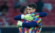 Kepa Arrizabalaga and David Raya of Arsenal share a hug during the pre-season friendly mat...
