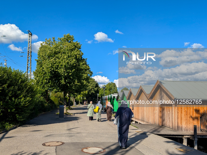 Women Walking By Lake Promenade In Summer