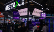 A general view shows fairgoers in front of the Metax booth at the Shanghai New Expo Center...