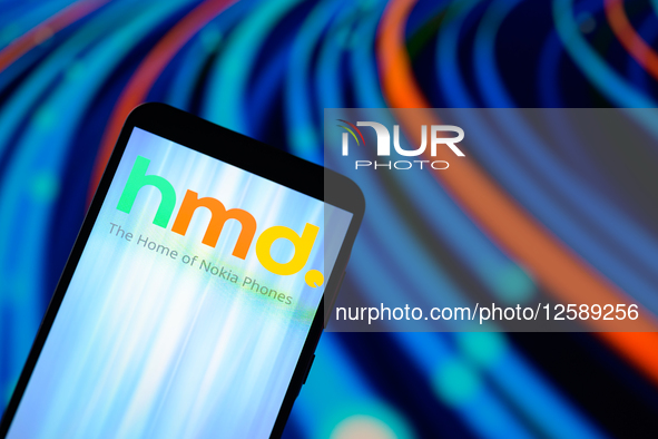 The HMD logo is displayed on a mobile phone with Nokia in the background in this photo illustration in Brussels, Belgium, on July 26, 2025. 