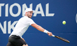 Dan Martin of Canada plays a backhand against Taro Daniel of Japan during the Men's Single...