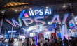 Visitors view the Kingsoft WPS booth at the 2025 WAIC World Artificial Intelligence Confer...