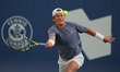 Liam Draxl of Canada plays a forehand against Pablo Carreno Busta of Spain during the Men'...