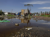 Homes are affected by the partial overflow of the La Cienega canal in Tlahuac, Mexico City, on July 29, 2025, which is exacerbated by low-ly...
