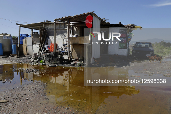 Homes are affected by the partial overflow of the La Cienega canal in Tlahuac, Mexico City, on July 29, 2025, which is exacerbated by low-ly...