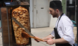 Shawarma is prepared outside an Afghani restaurant in Toronto, Ontario, Canada, on July 19...