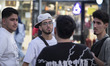 Iranian youths gather in a shopping and dining area in downtown Tehran, Iran, at sunset on...