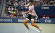 Ben Shelton of the United States plays a forehand against Flavio Cobolli of Italy during t...