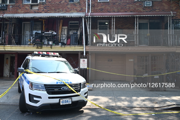 Officers of the New York City Police Department guard the scene where a 45-year-old man is fatally stabbed in the chest inside 40-38 Case St... by Kyle Mazza/NurPhoto