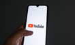 The YouTube logo appears on a smartphone screen in this photo illustration in Athens, Gree...