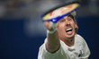 Alex De Minaur of Australia plays a backhand against Ben Shelton of the United States duri...
