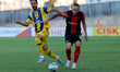 Sagiv Jehezkel of Maccabi Tel Aviv vies for the ball with Ryan Camenzuli of Hamrun Spartan...