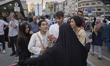A veiled woman who is a member of a group known as the Daughters of the Revolution asks yo...