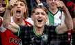 Supporters of Feyenoord Rotterdam attend the match between Feyenoord and Fenerbahce at the...