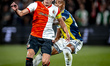 Feyenoord Rotterdam midfielder Sem Steijn and Fenerbahce SK midfielder Archie Brown play d...