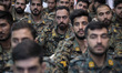 Military members of the Iranian police special forces participate in a ceremony at the Ima...
