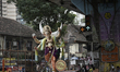 Devotees gather as a large idol of the Hindu god Ganesha is carried through a street durin...