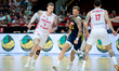 Aleksander Balcerowski, Viktor Gaddefors, and Dominik Olejniczak play during a basketball...