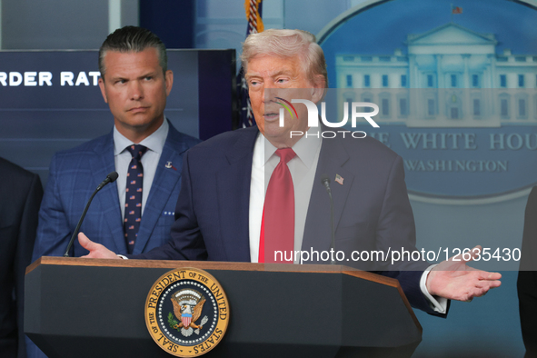 Flanked by U.S. Secretary of Defense Pete Hegseth and other administration officials, not pictured, President Donald Trump speaks during a p... by Bryan Dozier/NurPhoto