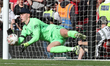 Dean Henderson of Crystal Palace makes a save from Liverpool's Harvey Elliott during The F...
