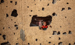 A displaced Palestinian girl looks through a hole in a wall in western Gaza City, on Augus...