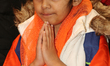 A Sikh girl offers prayers at a gurdwara (Sikh Temple) during Vaisakhi in Toronto, Ontario...