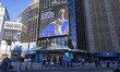 A screen over Pennsylvania station displaying KNICKS and ticketmaster add. Exterior street...