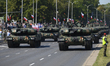 Soldiers of the Polish armed forces ride Leopard 2PL main battle tanks during the National...