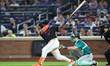 New York Mets' Francisco Alvarez hits a three-run homer during the eighth inning of a base...