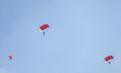 Indonesian Armed Forces soldiers perform a parachute jump at Indonesia's 80th Independence...