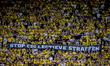 A banner on the stands reads ''STOP COLLECTIEVE STRAFFEN'' during the match between NAC an...