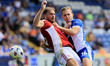 Will Sutton of Oldham Athletic Association Football Club tussles with Harry Smith of Swind...