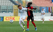 Aleksandar Filipovic of RFS is closely followed by Saliou Thioune of Hamrun Spartans durin...
