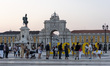 People walk through Praca do Comercio in Lisbon, Portugal, on August 22, 2025, as internat...
