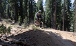 Competitors race down stage two of the Northstar Enduro in Truckee, California, on August...