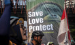 The cyclist community and environmental activists from the Satya Bumi organization conduct...