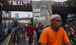 Environmental activists from the Satya Bumi organization unfurl a giant banner during a ca...