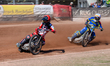 Zach Cook of Belle Vue Aces in red leads Nick Morris of Sheffield Tigers in white during t...