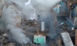 Smoke rises from a five-storey residential building in the Darnytskyi district, which is d...