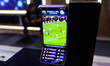 Samsung unveils a triple-fold vertical AMOLED device that displays a live football match w...