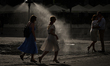 KRAKOW, POLAND - AUGUST 28:People walk by a water sprinkler set up in Krakow's Market Squ...