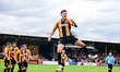 Kell Watts of Cambridge United celebrates after scoring the team's first goal during the S...